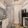 a kitchen with white cabinets a sink a stovetop a dishwasher and a fridge